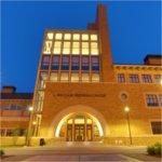 Exterior of L. William Seidman Center at night.